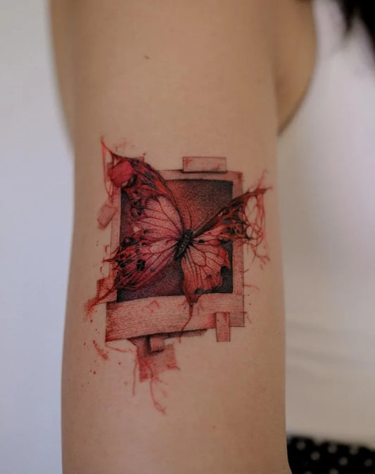 Surrealism Butterfly on Women Upper Arm Tattoo by @guncealtun