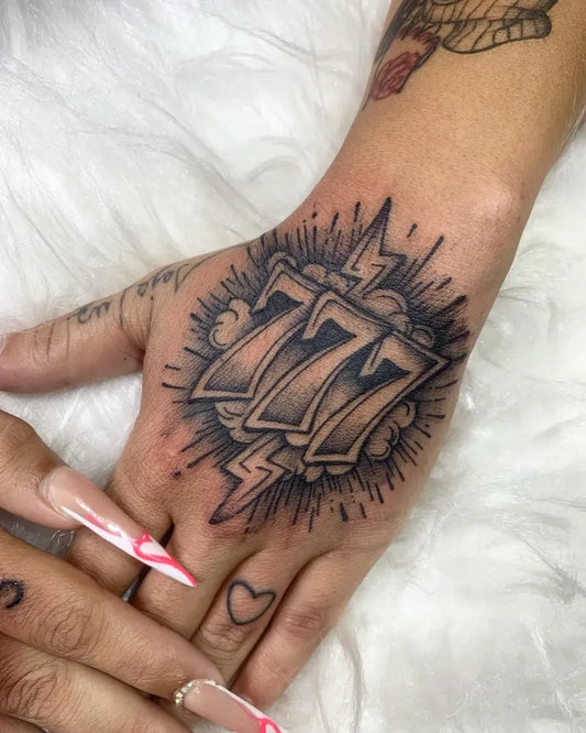 Medium Traditional 777 Slot Machine Tattoo on Women Hand by @binhotattooarte