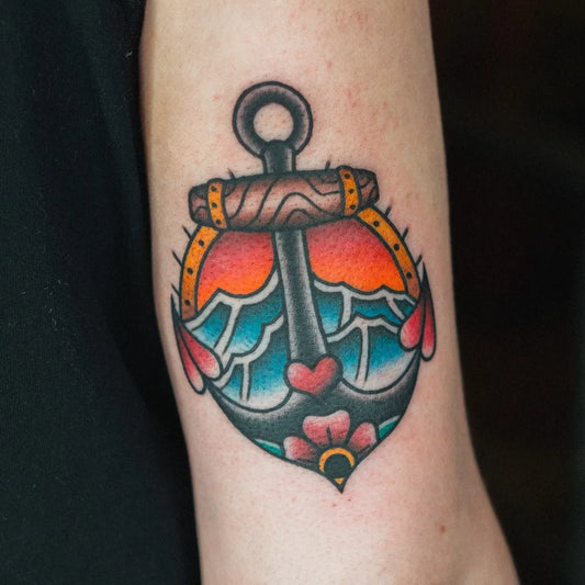 Medium Traditional Anchor with Heart and Waves Tattoo on Women Arm by @goodtimesink
