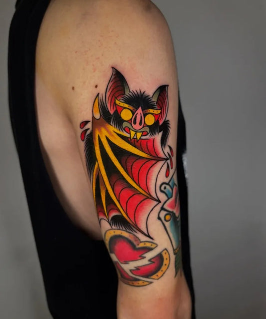 Medium Traditional Bat Heart Tattoo on Men Arm by @alexcorvustattoo