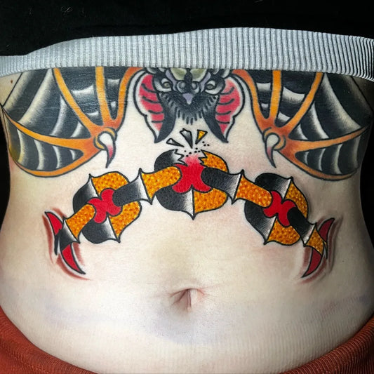 Medium Traditional Bat and Heart Chain Tattoo on Women Stomach by @jaysinburgesstattoos
