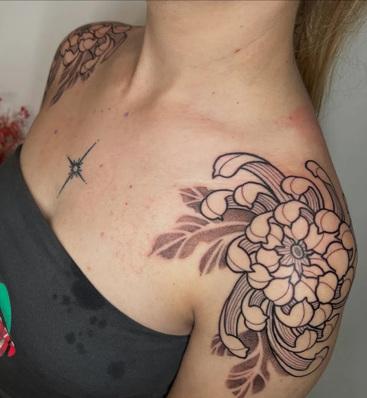 Medium Traditional Chrysanthemum with Leaves and Star Tattoo on Women Shoulder by @maisieellistattoos
