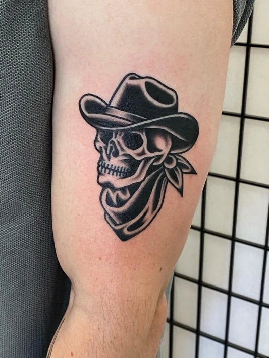 Medium Traditional Cowboy Skull with Bandana Tattoo on Men Arm by @kingsleytattoo