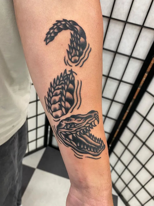 Medium Traditional Crocodile Tattoo on Men Arm by @kingsleytattoo