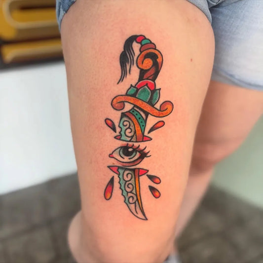 Medium Traditional Dagger with Eye Tattoo on Women Thigh by @mrcizdog