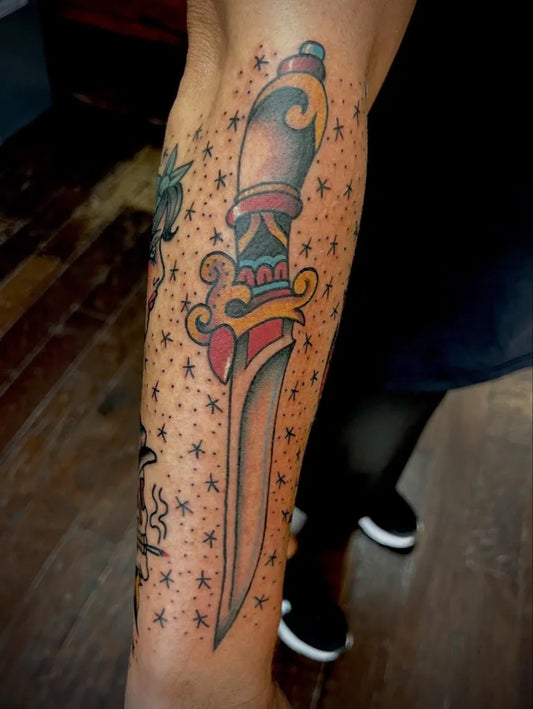 Medium Traditional Dagger with Stars Tattoo on Men Arm by @chriskime