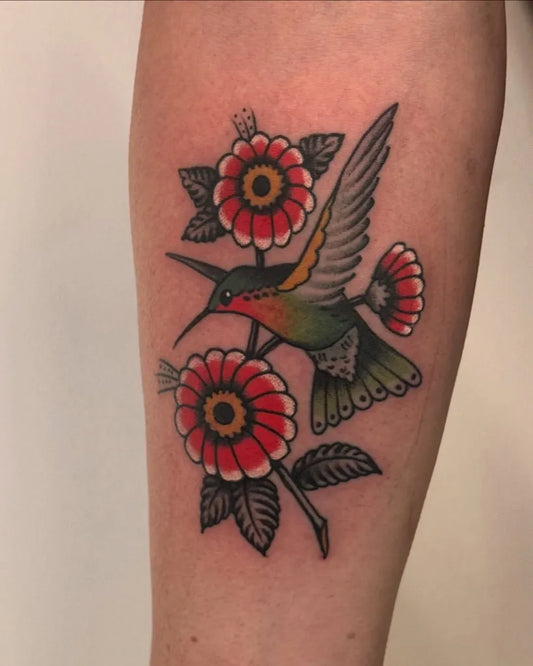 Medium Traditional Hummingbird and Flowers on Women Arm Tattoo by @tattoopaulski