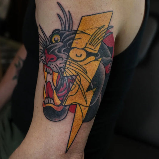 Medium Traditional Panther Lightning Tattoo on Men Arm by @tadejatattoo