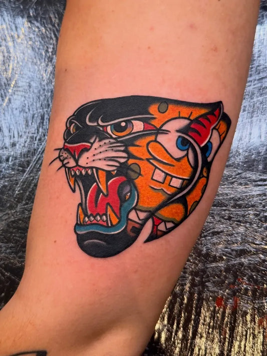 Medium Traditional Panther Tattoo on Women Arm by @straydogstattoo