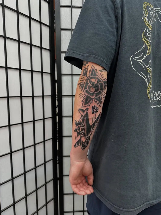 Medium Traditional Rose Skull Wolf Tattoo on Men Arm by @jackxtattoo