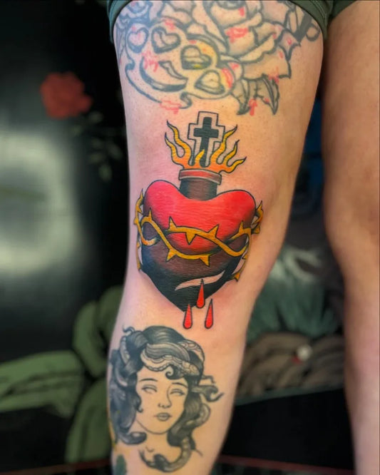 Medium Traditional Sacred Heart Crown Cross Tattoo on Women Thigh by @riley_tattoo