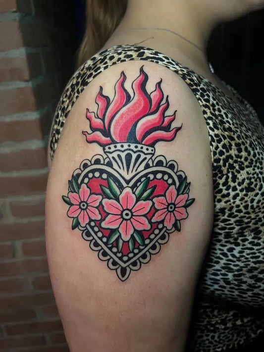 Medium Traditional Sacred Heart with Flowers Tattoo on Women Shoulder by @donna_mayla_tattooer_