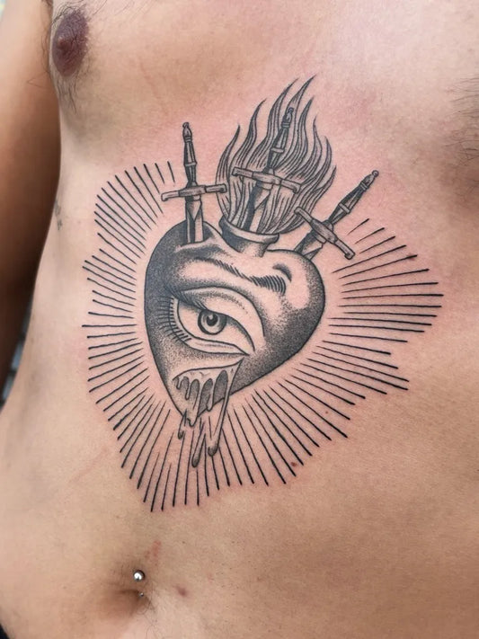 Medium Traditional Sacred Heart with Swords and Flames Tattoo on Men Chest by @mr.long_tattooer