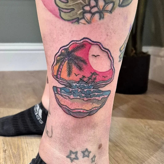 Medium Traditional Seashell Palm Sun Nautical Tattoo on Women Ankle by @before_the_mast