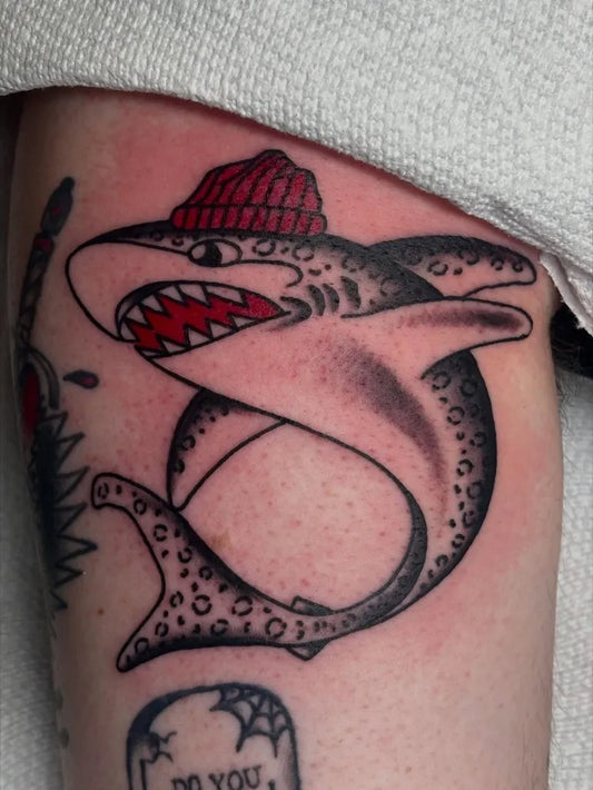 Medium Traditional Shark with Beanie on Men Arm Tattoo by @lilybayertattoos
