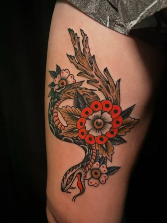 Medium Traditional Snake and Flowers Tattoo on Women Thigh by @sarapurr