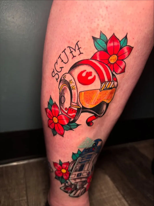 Medium Traditional Star Wars Helmet and R2D2 Tattoo on Women Leg by @wesmane