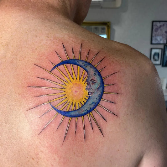 Medium Traditional Sun and Moon Spiritual Tattoo on Men Back by @theinkredibleparlour_tattoo