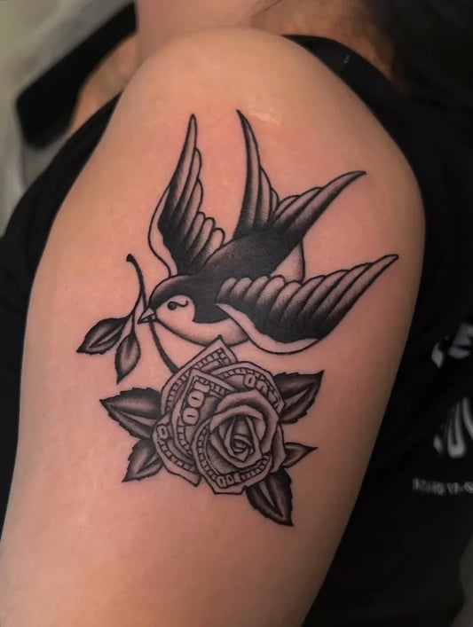 Medium Traditional Swallow and Money Rose Tattoo on Women Shoulder by @nico_tattoos
