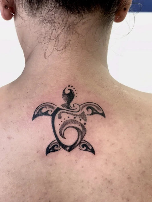 Medium Tribal Sea Turtle Tattoo on Women Neck by @artistic_studio_hair_tattoo