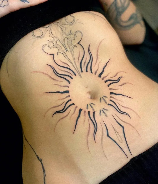 Medium Tribal Sun on Women Abdomen Tattoo by @kemp_ink