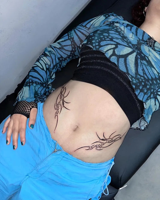 Medium Tribal Tribal Swirls Tattoo on Women Stomach by @armin.agne