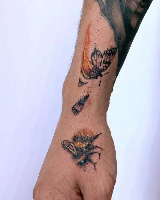 Medium Watercolor Bee Butterfly Flames on Men Arm Tattoo by @asiacirci.tattoo