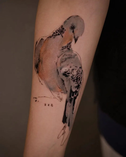 Medium Watercolor Bird Tattoo on Women Arm by @tattooer_nadi