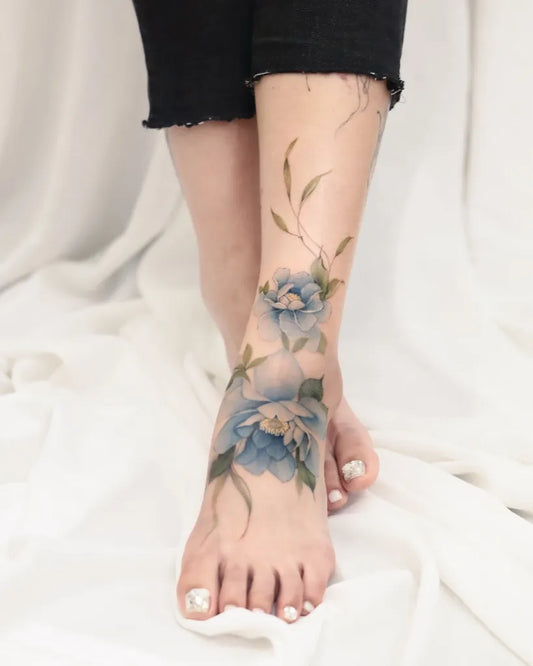 Medium Watercolor Blue Lotus Flower Tattoo on Women Foot by @tattooist_silo