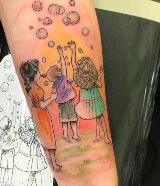 Medium Watercolor Bubbles Children Family Tattoo on Women Arm by @oldrepublictattoo