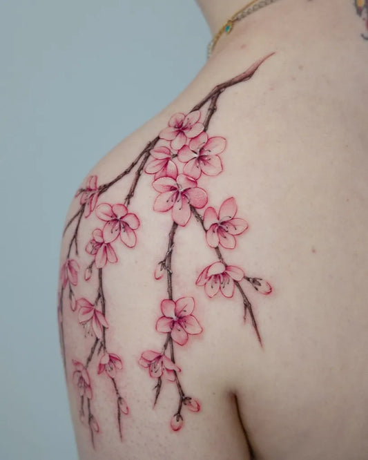 Medium Watercolor Cherry Blossom Branches on Women Shoulder Tattoo by @suya_ink
