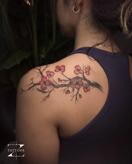Medium Watercolor Cherry Blossom Branches on Women Shoulder Tattoo by @ztattoosstudio