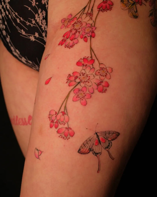 Medium Watercolor Cherry Blossom Butterfly on Women Thigh Tattoo by @liu.di.di