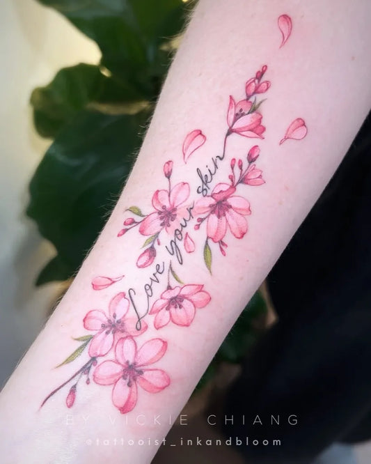 Medium Watercolor Cherry Blossom Love Script on Women Arm Tattoo by @tattooist_inkandbloom
