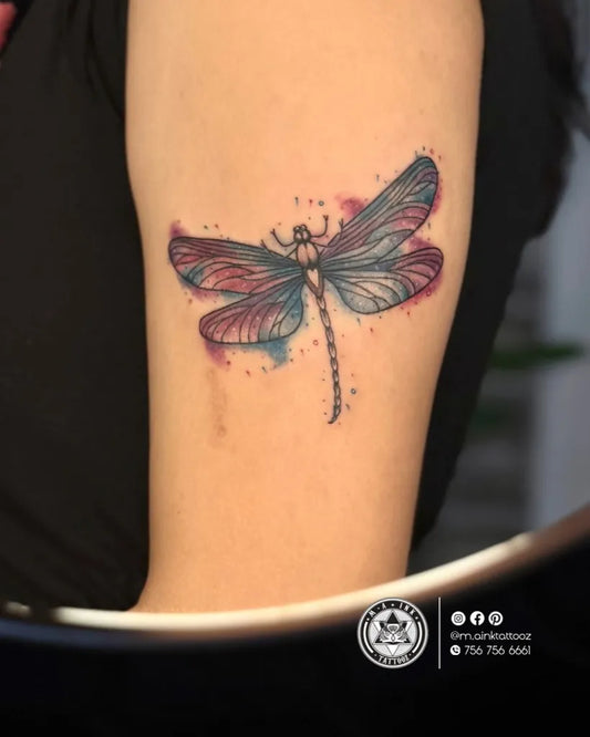 Medium Watercolor Dragonfly on Women Arm Tattoo by @m.ainktattooz
