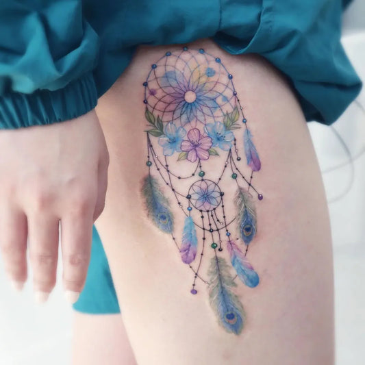 Medium Watercolor Dream Catcher Feathers Flowers Tattoo on Women Thigh by @siren_ink