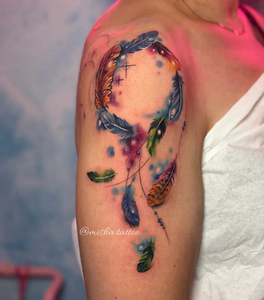 Medium Watercolor Dream Catcher Feathers Tattoo on Women Shoulder by @misha.tattoo