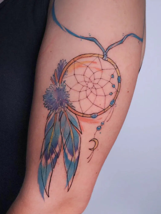 Medium Watercolor Dream Catcher with Feathers and Crescent Moon Tattoo on Women Arm by @petrafontattoo
