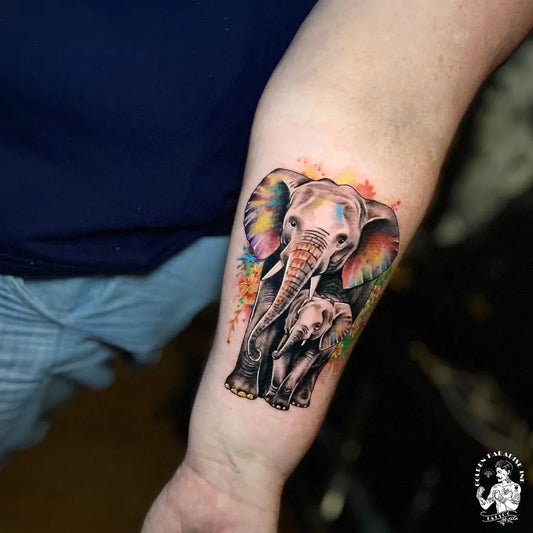 Medium Watercolor Elephant Mother and Baby Tattoo on Women Arm by @goldenparadiseink