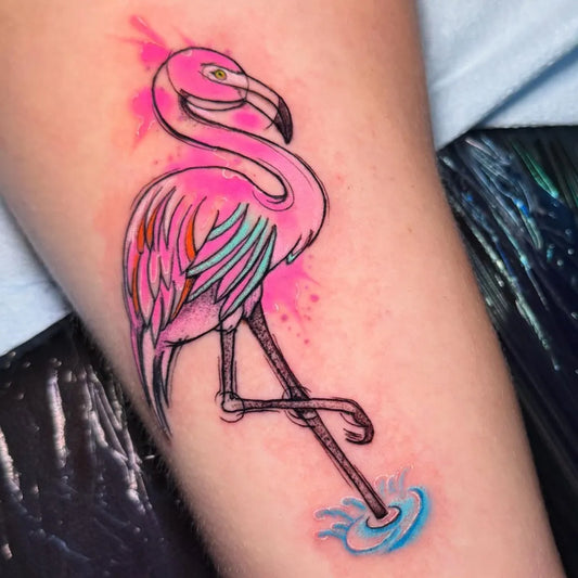 Medium Watercolor Flamingo Tattoo on Women Arm by @justin_tyme_tattoos