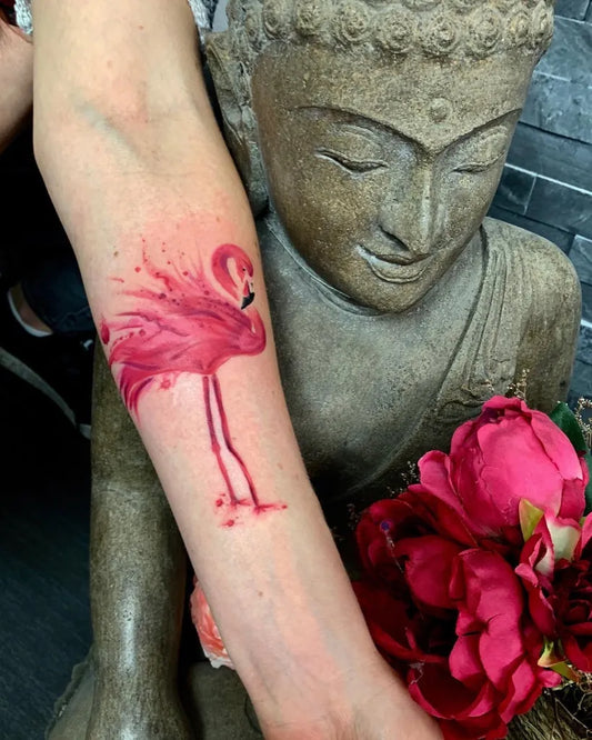 Medium Watercolor Flamingo Tattoo on Women Arm by @tattoomija