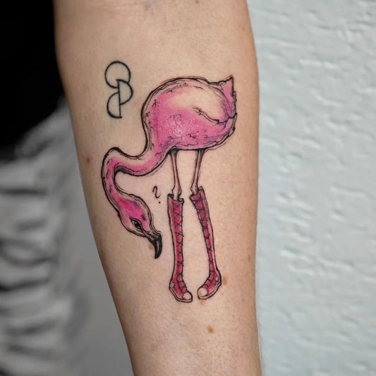 Medium Watercolor Flamingo with Boots Tattoo on Women Arm by @patrizia.aurelia