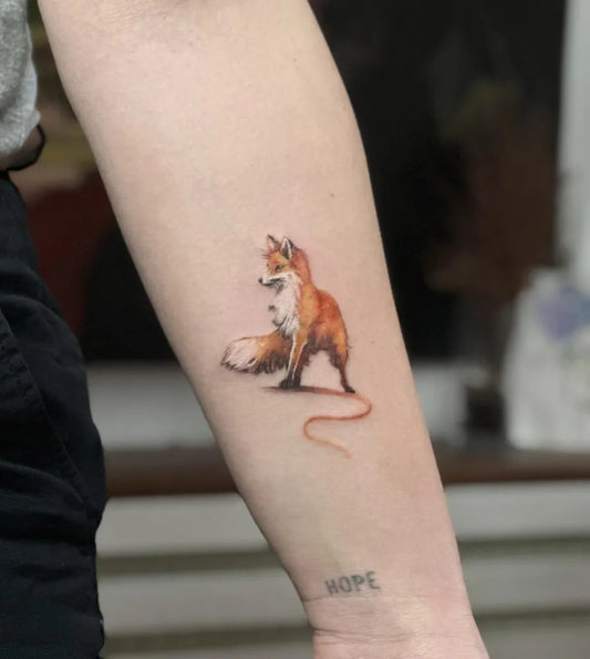 Medium Watercolor Fox Tattoo on Women Arm by @sam.drive