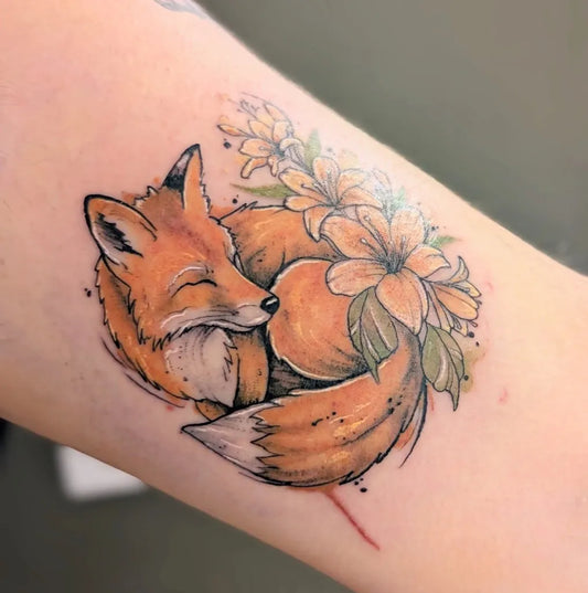 Medium Watercolor Fox and Lily Flowers Tattoo on Women Arm by @lil.jose.tattoo