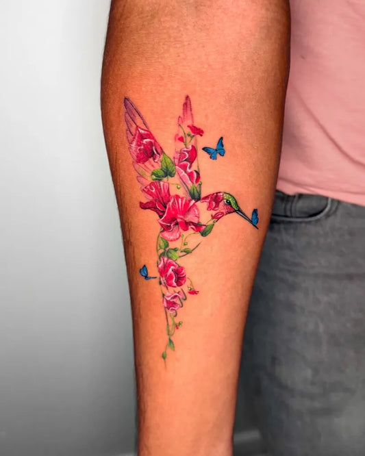 Medium Watercolor Hummingbird Flowers Butterflies on Women Arm Tattoo by @peria_tattoo