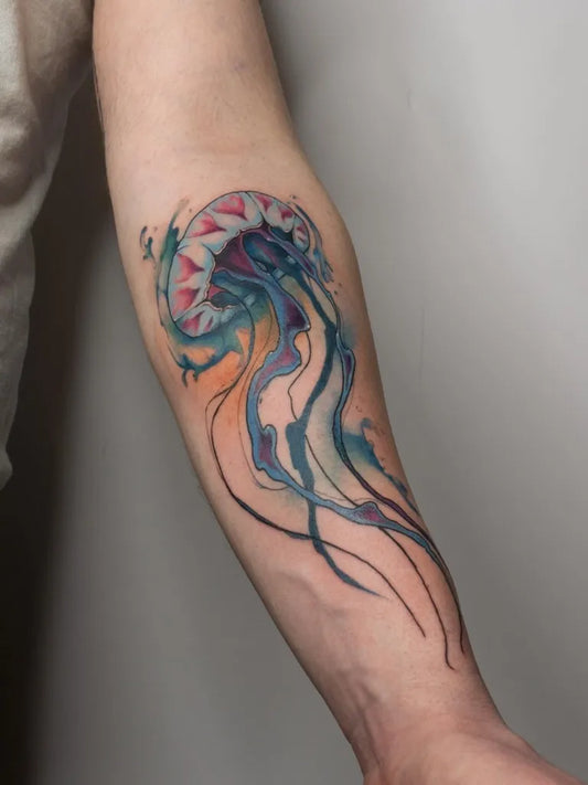 Medium Watercolor Jellyfish Tattoo on Men Arm by @inkarmen.tattoos