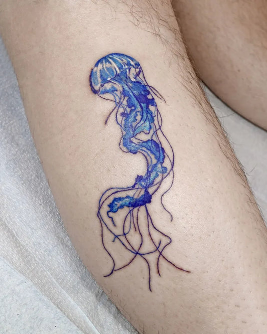 Medium Watercolor Jellyfish Tattoo on Men Leg by @aroha_tattoo