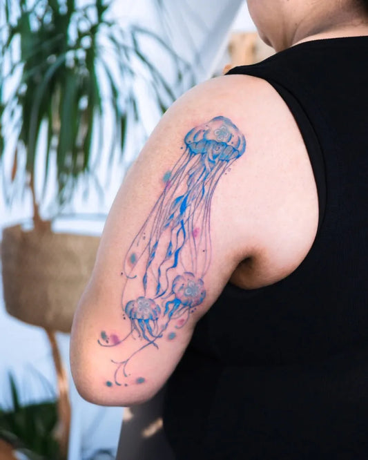Medium Watercolor Jellyfish Tattoo on Women Arm by @ski_artoo