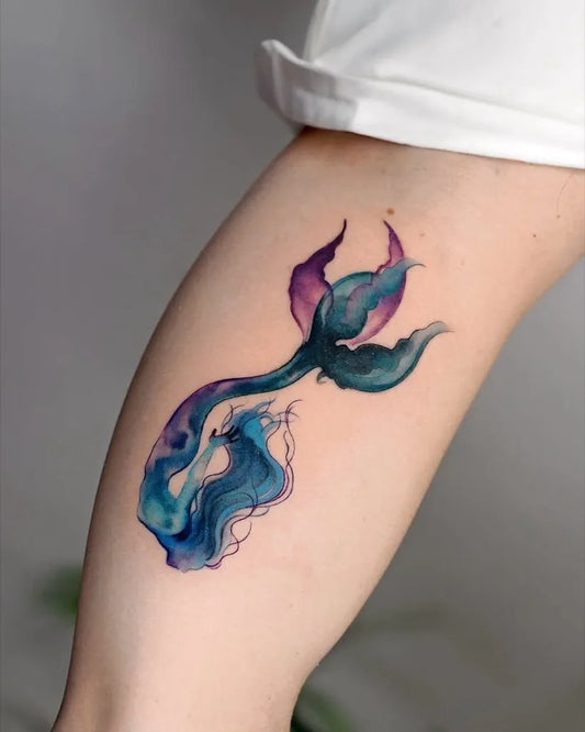 Medium Watercolor Mermaid Tattoo on Women Arm by @labeltattoo