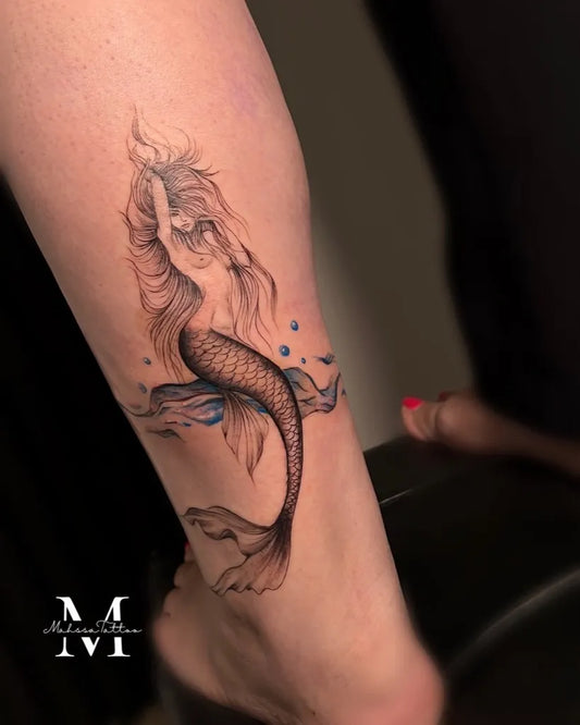 Medium Watercolor Mermaid Tattoo on Women Thigh by @mahsatattoo.ink